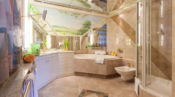 Einblick in das geräumige Badezimmer mit einer Eckbadewanne, Dusche und Bidet 